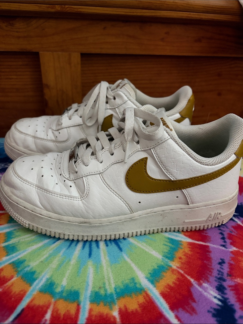 Nike White Low-Top Sneakers with Gold Swoosh and Heel Tab